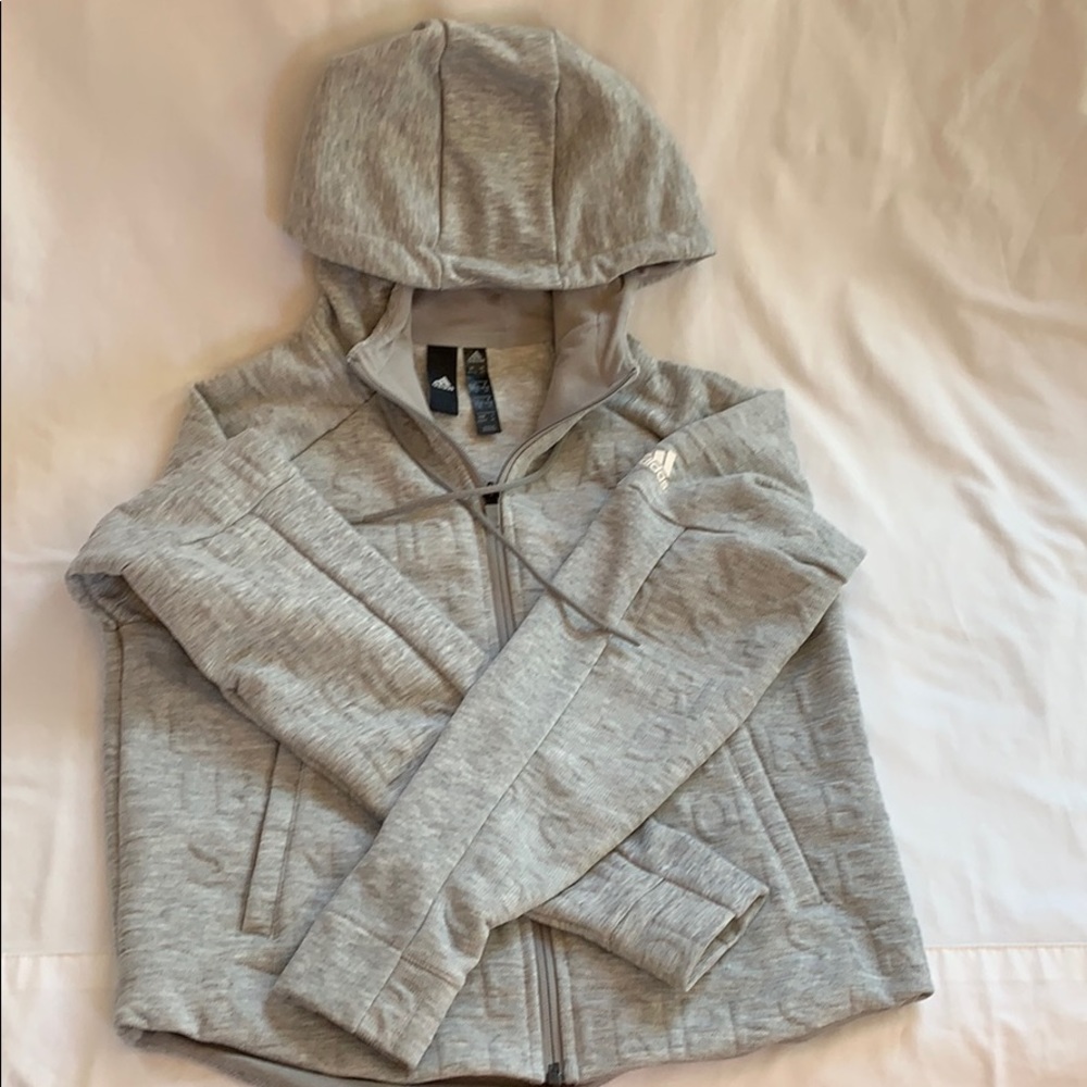 Never worn Adidas sports zip-up hoodie. XS grey